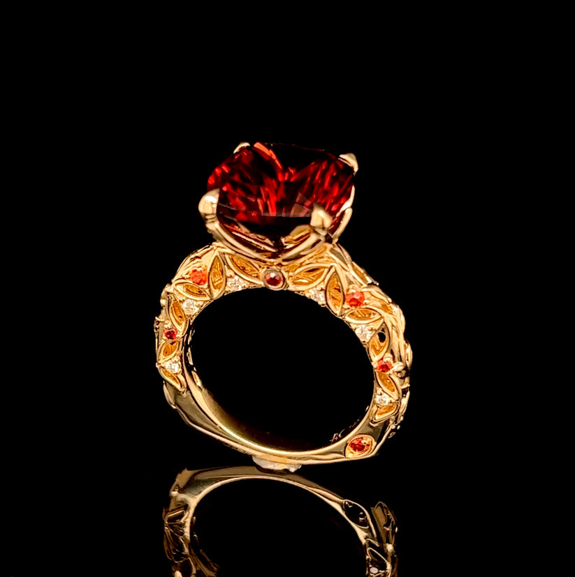 Fiery Red Umbalite set in 14k yellow gold petal and vines desig