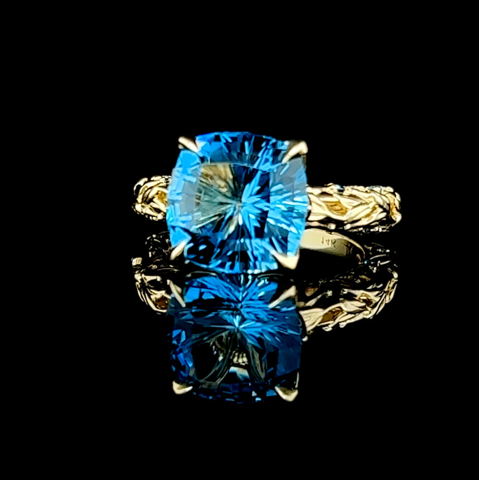 London Blue Topaz set in 14k yellow gold with diamond and London Blue accents